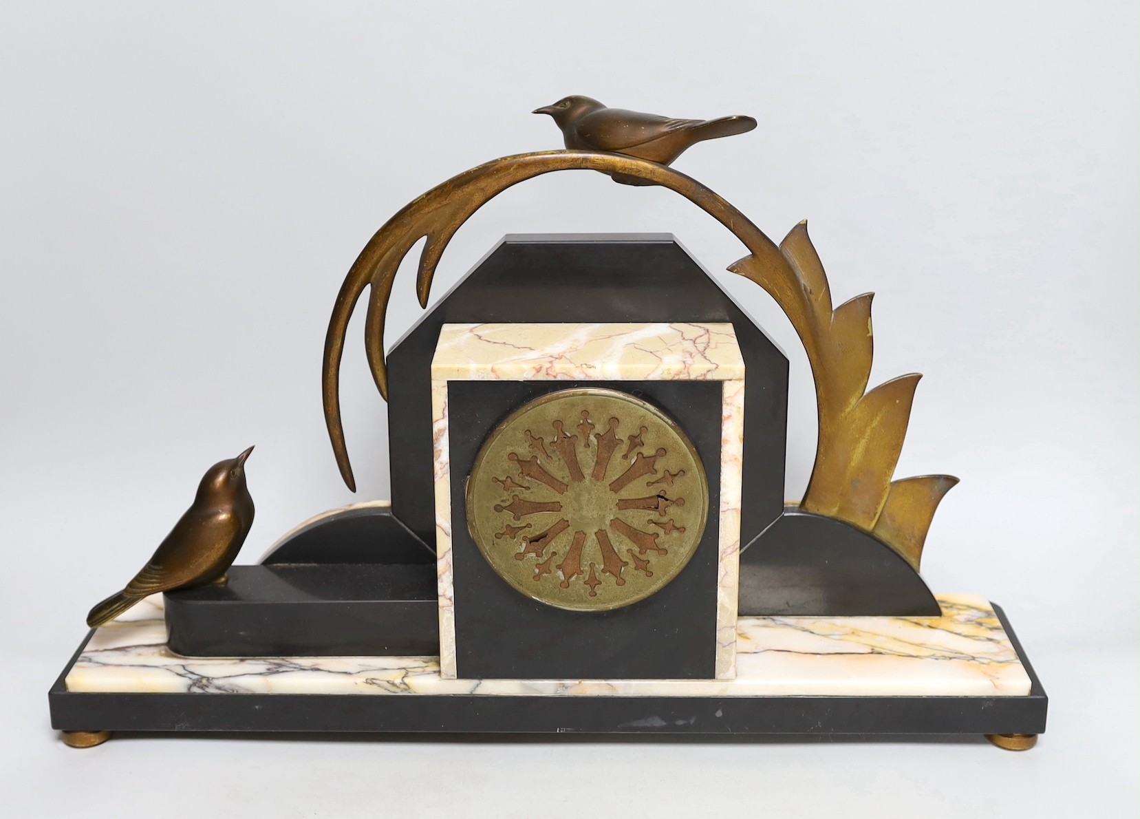 A French Art Deco bronze decorated black chrome and coloured marble clock on base. 48cm wide
